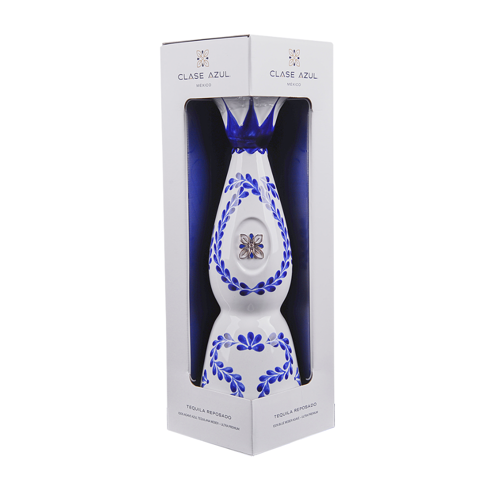 Clase Azul Plata silver tequila ceramic decanter with hand-painted cobalt-blue floral artwork displayed inside its white presentation gift box
