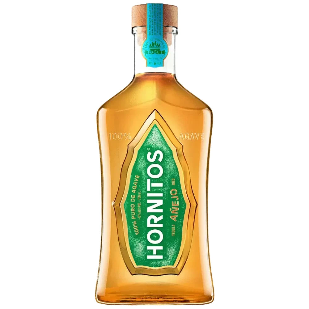 A bottle of Anejo Hornitos tequila against a solid white background. The clear glass bottle showcases the golden-amber liquid inside, featuring a prominent green and gold label with white text, a cork stopper, and a blue seal on the neck.