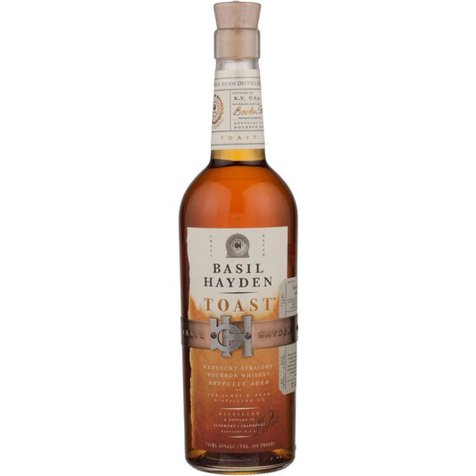 A bottle of Basil Hayden's Straight Bourbon Toast Small Batch 80 whiskey with a 750ml label, cork closure, and a clear glass container.