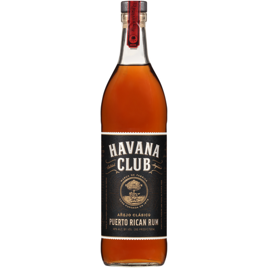 Bottle of Havana Club Añejo Clásico Puerto Rican Rum with a red foil neck and black-and-gold label, showing the deep amber aged rum inside the 750ml bottle