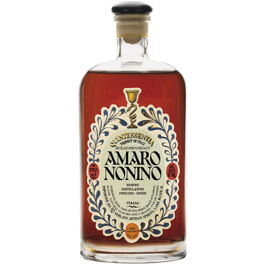 Nonino Amaro Quintessentia 70 in an ornate clear 750ml bottle showing deep amber amaro and a decorative cream label with a blue botanical border
