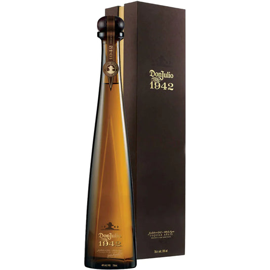 Don Julio 1942 Anejo Tequila in a tall slender amber bottle with a dark stopper and gold Don Julio 1942 lettering beside its dark brown presentation box