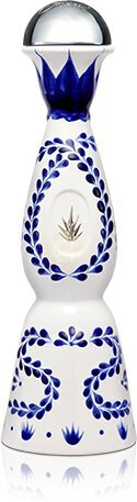 Clase Azul Reposado Tequila in its iconic hand-crafted white ceramic decanter with hand-painted blue floral artwork and a sculpted lily-shaped stopper